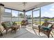 Comfortable, screened porch with wicker furniture and lake views, great for entertaining at 1068 Lizzie Ln., Surfside Beach, SC 29575