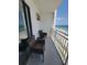 Balcony with chairs offering beautiful views of the beach and the ocean at 1207 S Ocean Blvd. # 20806, Myrtle Beach, SC 29577
