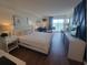 Bright bedroom with a queen bed, sitting area, desk, and views of the ocean at 1207 S Ocean Blvd. # 20806, Myrtle Beach, SC 29577