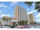View of multi-story building with beach access, lush landscaping, and outdoor amenities at 1207 S Ocean Blvd. # 20806, Myrtle Beach, SC 29577