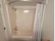 Clean shower stall with a white shower curtain and accessible shower head fixture at 1207 S Ocean Blvd. # 20806, Myrtle Beach, SC 29577
