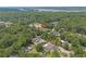 Serene aerial view of a home nestled among lush trees, showcasing its peaceful and secluded location at 124 Wicklow Way, Pawleys Island, SC 29585