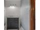 Bathroom featuring a dark vanity with marble countertop and shiplap wall at 124 Wicklow Way, Pawleys Island, SC 29585