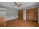 Spacious bedroom with ceiling fan, wood floors and large wooden closet doors at 124 Wicklow Way, Pawleys Island, SC 29585