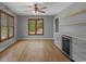 Bright dining area with hardwood floors, a stylish wine cooler, and large windows offering lovely outdoor views at 124 Wicklow Way, Pawleys Island, SC 29585