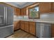 Charming kitchen featuring stainless steel appliances, wood cabinets, and ample counter space at 124 Wicklow Way, Pawleys Island, SC 29585