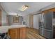 Open kitchen and dining area with stainless steel appliances and natural light at 124 Wicklow Way, Pawleys Island, SC 29585