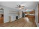 Open kitchen and dining area with stainless steel appliances, sleek countertops, wine cooler, and hardwood floors at 124 Wicklow Way, Pawleys Island, SC 29585