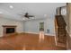 Inviting living room with hardwood floors, brick fireplace, ceiling fan, and ample natural light at 124 Wicklow Way, Pawleys Island, SC 29585