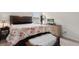 Bedroom with warm accents, floral bedding, and plenty of sunlight at 125 Foxford Dr., Conway, SC 29526