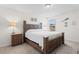 Cozy primary bedroom features carpet floors, a large wood bed frame, and bedside tables with lamps at 125 Foxford Dr., Conway, SC 29526