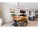 Eat-in kitchen and dining area features a wooden table and decorative chandelier, with easy access to the kitchen at 125 Foxford Dr., Conway, SC 29526