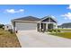 Charming single-story home featuring light-grey horizontal siding at 125 Foxford Dr., Conway, SC 29526