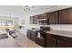 Well-appointed kitchen featuring dark wood cabinets, stainless appliances, and a kitchen island at 125 Foxford Dr., Conway, SC 29526