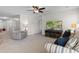 Cozy living room featuring plush seating, a ceiling fan, and ample natural light at 125 Foxford Dr., Conway, SC 29526