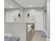 Bathroom showing a soaking tub with tile surround, adjacent to glass-enclosed shower and white doors at 1305 Forest View Rd., Conway, SC 29526