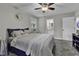 Comfortable bedroom with a full size bed, ceiling fan and a partial view of an attached bathroom at 1305 Forest View Rd., Conway, SC 29526