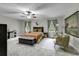 Serene bedroom features soft lighting, ceiling fan, and neutral color palette at 1305 Forest View Rd., Conway, SC 29526