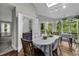 Bright dining room with a skylight, bar area, and views of the outdoor scenery at 1305 Forest View Rd., Conway, SC 29526