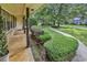 Neatly landscaped front yard with trimmed shrubbery and sidewalk adds curb appeal to the property at 1305 Forest View Rd., Conway, SC 29526