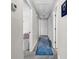 Hallway with gray carpet, leading to multiple rooms and doors and an eye-catching blue area rug at 1305 Forest View Rd., Conway, SC 29526