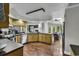 Open concept kitchen with wood cabinets, stainless appliances, and a view of the dining area and living room at 1305 Forest View Rd., Conway, SC 29526