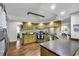 Spacious kitchen with wood cabinets, stainless steel appliances, and hardwood floors at 1305 Forest View Rd., Conway, SC 29526