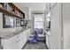 Well-lit office featuring built-in cabinets, desk, and shelves, perfect for a home workspace at 1305 Forest View Rd., Conway, SC 29526