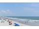 Wide beach area with blue sky and a long coastline perfect for a vacation at 134 Butkus Dr. # 7, Myrtle Beach, SC 29588