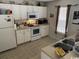 Well-lit kitchen featuring appliances and a window offering natural light at 134 Butkus Dr. # 7, Myrtle Beach, SC 29588