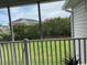 Serene screen porch view overlooking a lush green lawn and mature trees at 134 Butkus Dr. # 7, Myrtle Beach, SC 29588