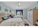Cozy bedroom with two beds, large window, and ample closet space at 145 South Dunes Dr. # 308, Pawleys Island, SC 29585