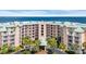 Stunning exterior view of a condo building with balconies and lush landscaping at 145 South Dunes Dr. # 308, Pawleys Island, SC 29585