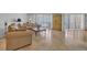 Comfortable living room with shuttered windows, a coffee table, sofa and stone floors at 145 South Dunes Dr. # 308, Pawleys Island, SC 29585
