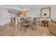 Open floor plan with kitchen to the left, dining area and living room with balcony in the distance at 145 South Dunes Dr. # 308, Pawleys Island, SC 29585