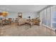 Living room with sofa and love seat, shuttered windows, a coffee table and stone floors at 145 South Dunes Dr. # 308, Pawleys Island, SC 29585