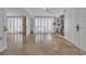 Bright living room featuring travertine floors and built-in bookcase and storage at 145 South Dunes Dr. # 308, Pawleys Island, SC 29585