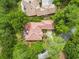 Aerial view showcasing the home's backyard patio and landscaping with a brick patio and red tiled roof at 1501 Harbor Dr., North Myrtle Beach, SC 29582