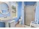Bathroom featuring a single sink vanity, toilet and a glass door shower at 1501 Harbor Dr., North Myrtle Beach, SC 29582