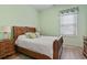 Bedroom with wooden furniture, wooden floors, and green walls at 1501 Harbor Dr., North Myrtle Beach, SC 29582