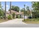 Charming single-story home with a red tile roof, mature landscaping, and a spacious driveway at 1501 Harbor Dr., North Myrtle Beach, SC 29582