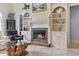 Close up on the fireplace with decorative tile work and built-in shelves with decor at 1501 Harbor Dr., North Myrtle Beach, SC 29582