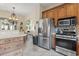 Kitchen with stainless steel appliances, beautiful wooden cabinets, and tiled floors at 1501 Harbor Dr., North Myrtle Beach, SC 29582