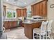 Cozy kitchen with tile countertops, stainless steel appliances and wood cabinets at 1501 Harbor Dr., North Myrtle Beach, SC 29582