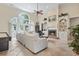 Bright living room featuring high ceilings, large windows, and a cozy fireplace with built-in shelving at 1501 Harbor Dr., North Myrtle Beach, SC 29582
