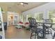 Bright, airy sunroom with multiple seating areas and views of the outdoors at 1501 Harbor Dr., North Myrtle Beach, SC 29582