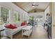Bright sunroom features large windows and comfortable seating at 1501 Harbor Dr., North Myrtle Beach, SC 29582