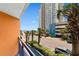 Balcony with a view of the ocean, palm trees, surrounding buildings, and the parking area at 1501 S Ocean Blvd. # 351, Myrtle Beach, SC 29577