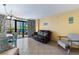 Inviting living space with balcony view, dining area, and comfortable seating at 1501 S Ocean Blvd. # 351, Myrtle Beach, SC 29577