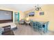Living area features a dining area with a granite countertop table, a lounge chair, and a bed at 1501 S Ocean Blvd. # 351, Myrtle Beach, SC 29577